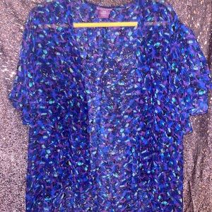 This is a a Purple,Blue,Green and Black Kimono. It is also sheer fabric.